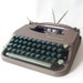 vintage typewriter smith corona skyriter manual typewriter portable carrying case lid two-tone green keys industrial mad men office home