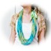 Handmade sea green crochet infinity scarf with lime ribbon bow