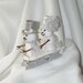 Snowman Couple on a Sled Wedding Cake Topper