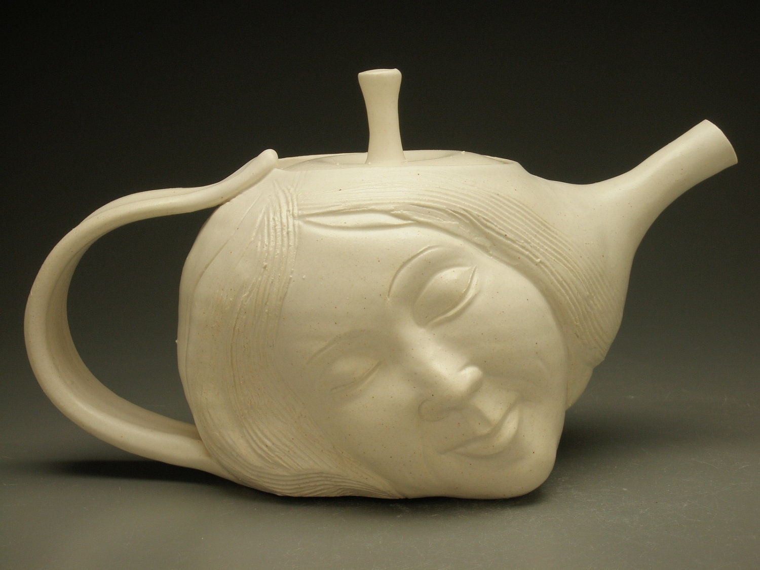 Porcelain Face Teapot Dreaming Dancer with Bas Relief Figure