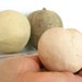Group of three earthenware fruit