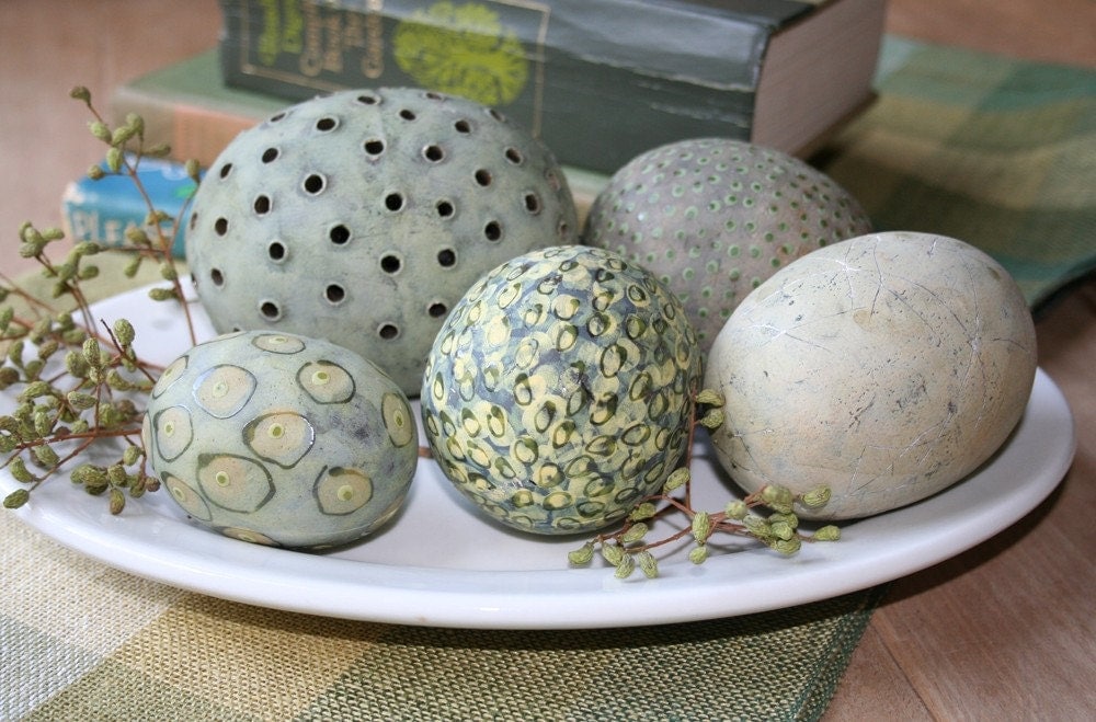 Group of five decorative ceramic spheres eggs in soft green