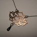 Lotus pendant in copper and hematite