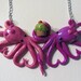 Intertwined Octopi fighting for a cupcake