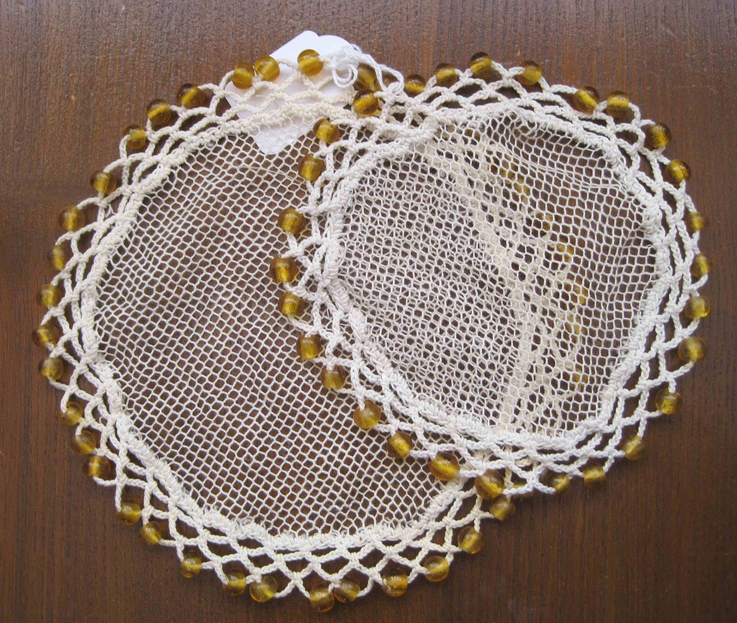 Two beaded jug or bowl covers keep the flies off your milk