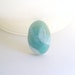 Larimar Cabochon Oval Larimar shape with creamy swirls