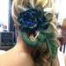 A Beautiful Peacock hair clip with large flower.