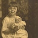 Studio Photo of little girl in glasses holding baby doll - Original vintage 8x10 photograph