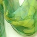 OAAK green silk chiffon scarf hand painted with yellow semi abstract spring flowers. Free shipping worldwide