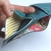Green leather wallet with space for cards coins and notes