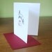 Rabbit leaping over cake greeting card, free shipping