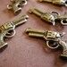 10 - Antique Bronze- Pistol Charm (ABPC)