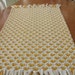 yellow heart rug made out of recycled t shirts