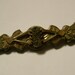 Antique Victorian chased gold brooch with Taille D'épargne enamel