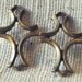 Brass crosses in an abstract design (4) Patina, Charm