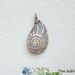 RESERVE LISTING for PALMSPROUT...Artisan Bronze Nautilus Pendant and two mini pendants