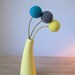 Big and round handfelted pom pom flower trio