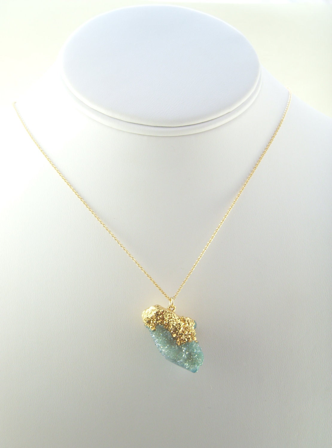 Gold Necklace adorned with an Aqua Spirit Quartz Dipped in