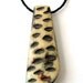 Spotted design dagger shape old bone pendant from Nepal