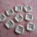 Vintage cool white round with square design plastic buttons. Wholesale lot of 9.