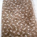 27" of Vintage millinery veiling in pale caramel with vanilla abstract dots