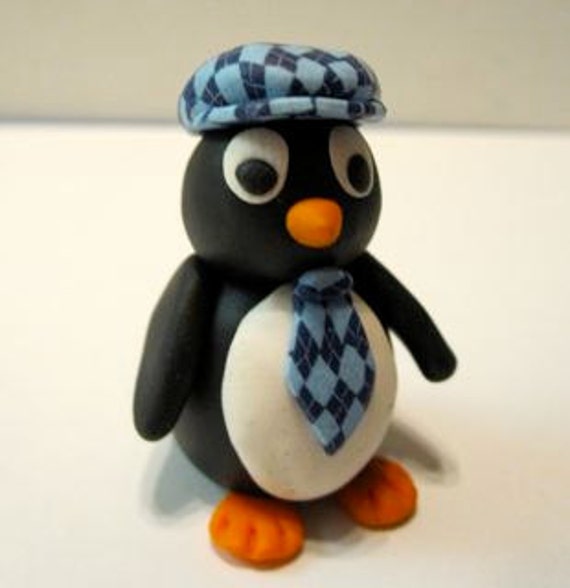 Polymer clay penguin figurine with argyle tie