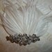 White bridal hair fascinator, feathers, rhinestone jeweled center, hair clip accessory
