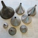 8 vintage funnels - assorted sizes and styles