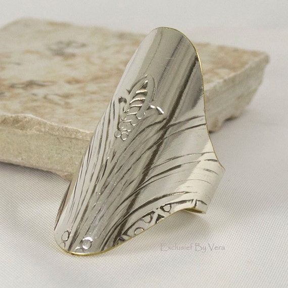 Unique, trendy, silver knuckle ring for guys and gals Unique, trendy, silver knuckle ring for guys and gals