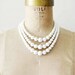 reserved....vintage beaded necklace - 1960s ivory pearl beads / 3 strand necklace