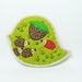 Denatured eye felt brooch