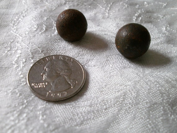 Two rusty old heavy metal balls maybe marbles vintage by Jorisna