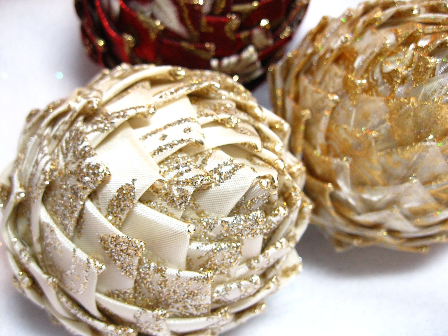 cream and gold collectible Christmas ornaments