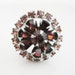 elegant adjustable vintage retro ring in a silver tone with amber color rhinestones