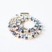 vintage jewelry sarah coventry clear and blue rhinestones bracelet on a gold tone
