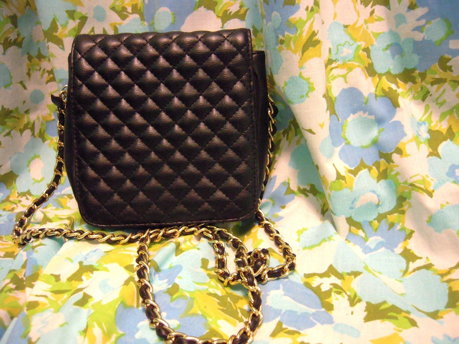 black quilted purse with gold chain