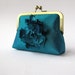 Peacock teal silk clutch bag with silk flower brooch