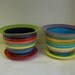 Medium Ceramic Flower Pot with Drip in Bright Rainbow Colored Stripes with Neon Green and Purple Interior