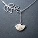 Matte white gold love bird and leaf branch necklace