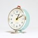 Vintage Russian mechanical alarm clock Slava from Soviet Union period turquoise colour