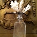 Vintage bottle with sea life sculpture