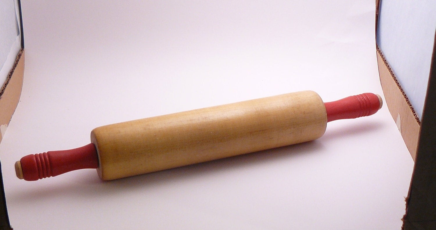 Vintage red handle rolling pin