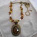 Vintage Gold Tone Avon Necklace with Glass Stones on Chain and Large Oval Faux Amber Pendant