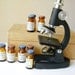 vintage microscope and french bottles