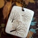 Earthy Porcelain Pendant with Impression of small leaves.