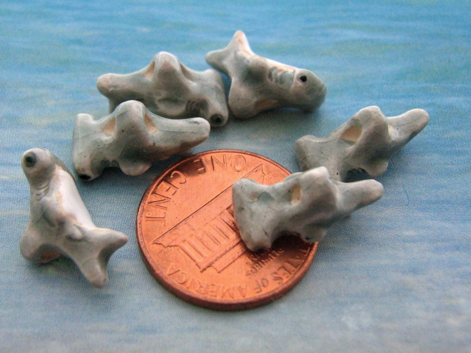 4 Tiny Hammerhead shark beads from TheCraftyBead on Etsy Studio