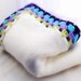 White Knitted Childrens Blanket with Purple Aqua Blue and Light Green Granny Square Edge