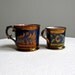 Two Copper Lustre Pottery Mugs with Cobalt Decoration, English, 19th century