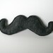 The Wilford Brimley felt catnip mustache cat toy in gray