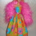 Fun floral handmade Barbie doll gown with bright pink boa